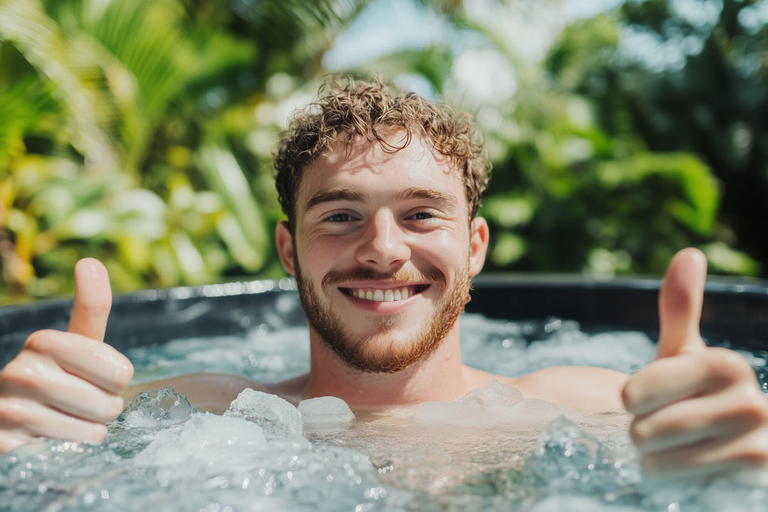 Smiling man enjoys an invigorating cold plunge in ice water, highlighting the benefits of Plunge Chill ice baths.