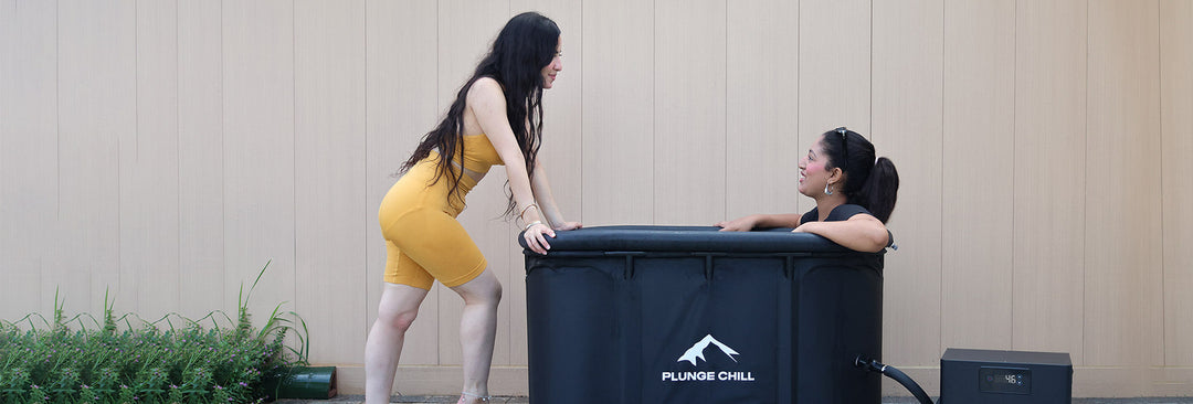 Two women using Plunge Chill cold plunge tub for ice bath weight loss therapy and brown fat activation.