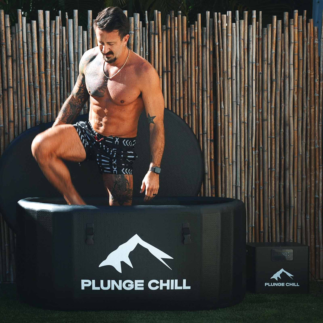 Man using Plunge Chill Pro Tub for cold water therapy and muscle recovery