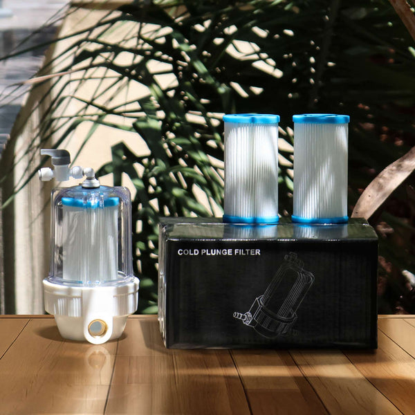 Cold plunge filter housing and replacement filter cartridges on a wooden table.