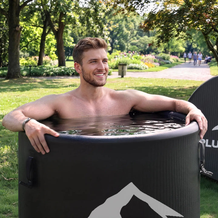 A handsome young man is taking a cold plunge.