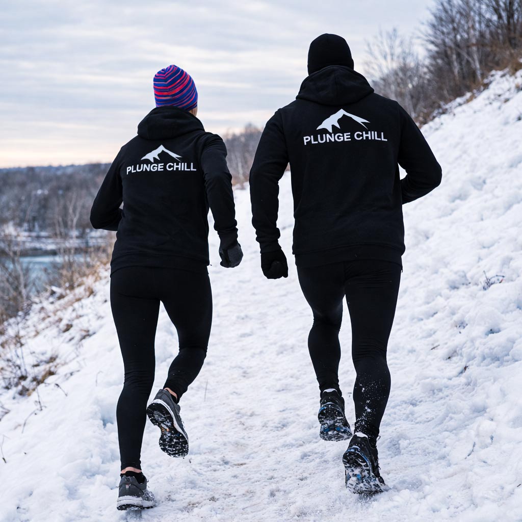 Plunge Chill - A man and a woman are running in the snow.